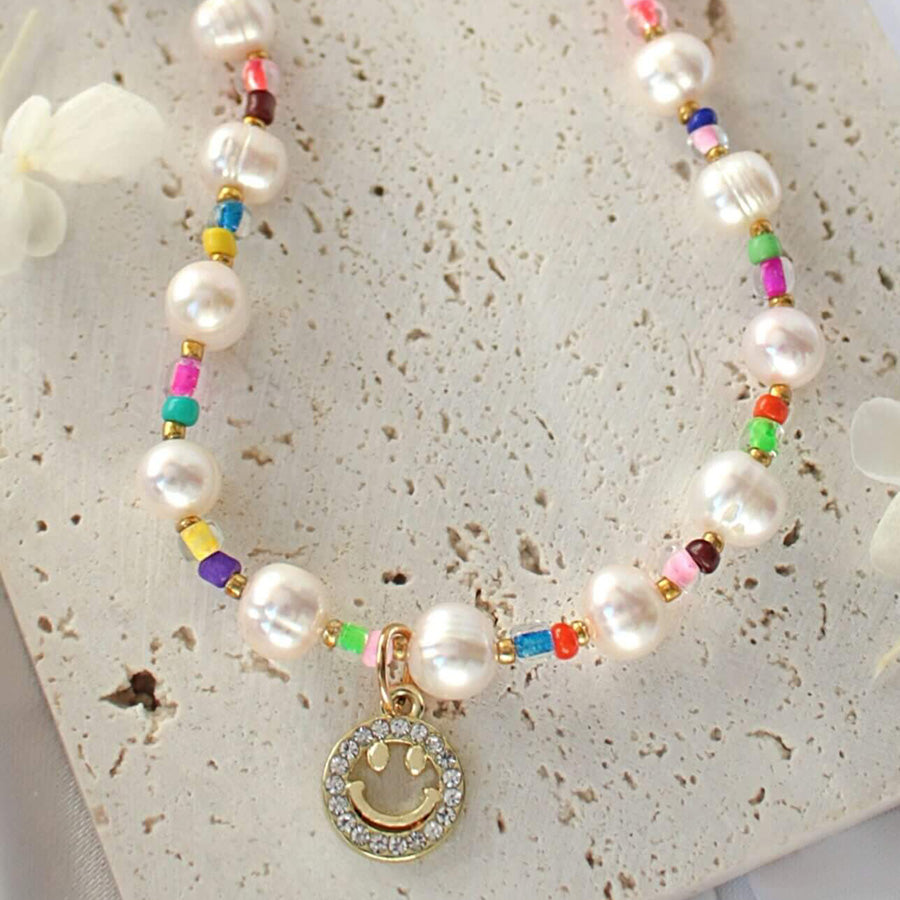 24-Karaatin Kullattu Makenvedenhelmikaulakoru Hymiöriipus - Divine Dulcet